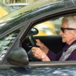 senior woman driving a car
