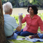 Senior Hispanic couple having a picnic