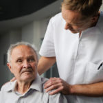 Healthcare worker and elderly patient